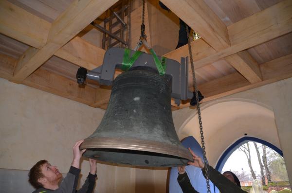 Bell being lifted up through new gallery floor
